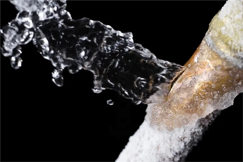 Water spraying from a frozen pipe that split in a Weld County cold snap